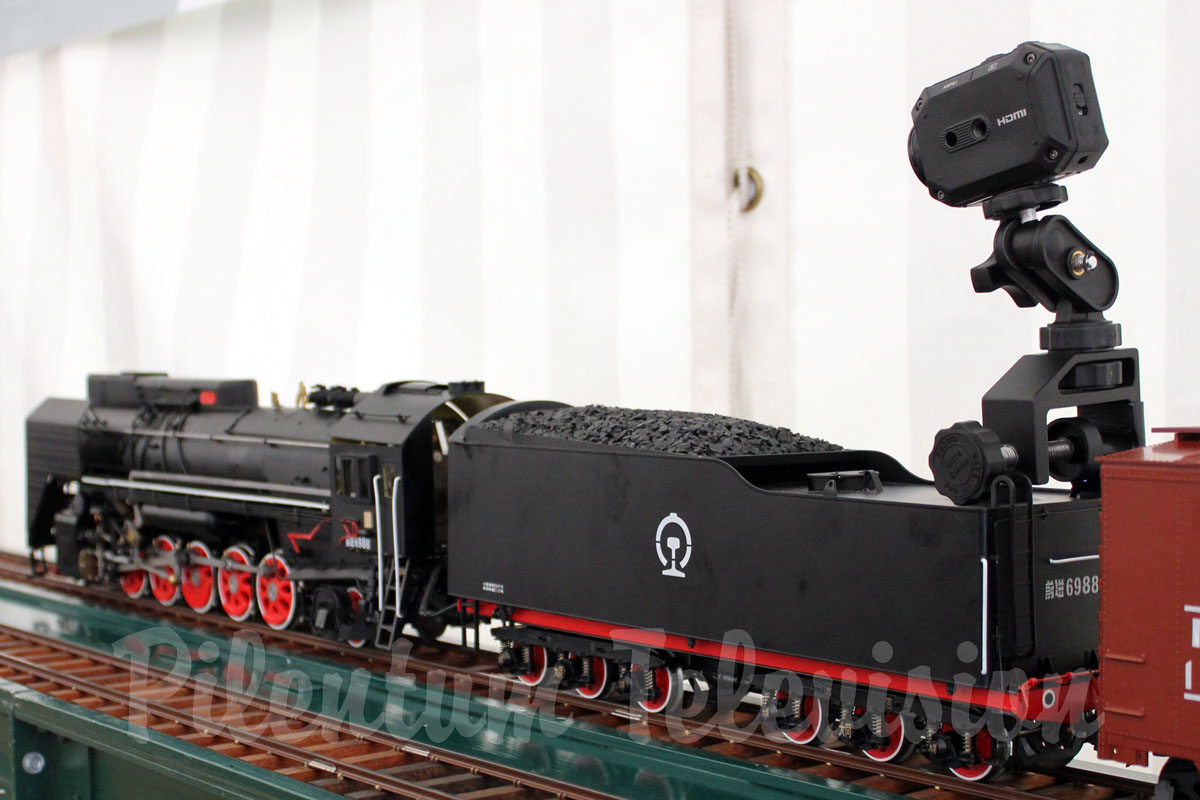 An essential accessory for video productions of garden railways and backyard railroads is a clamp tripod. Pilentum Television uses the Pedco UltraClamp that allows a camera to be solidly attached to any other object.