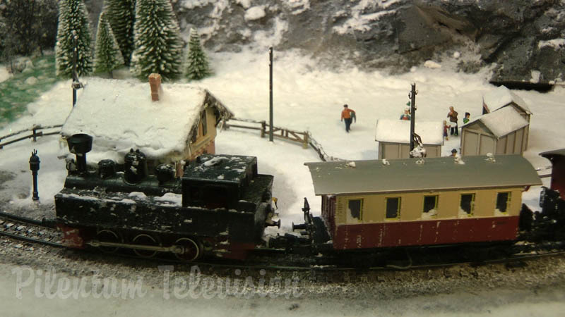 Cute and tiny model railroad layout with winter landscape by Hans Louvet