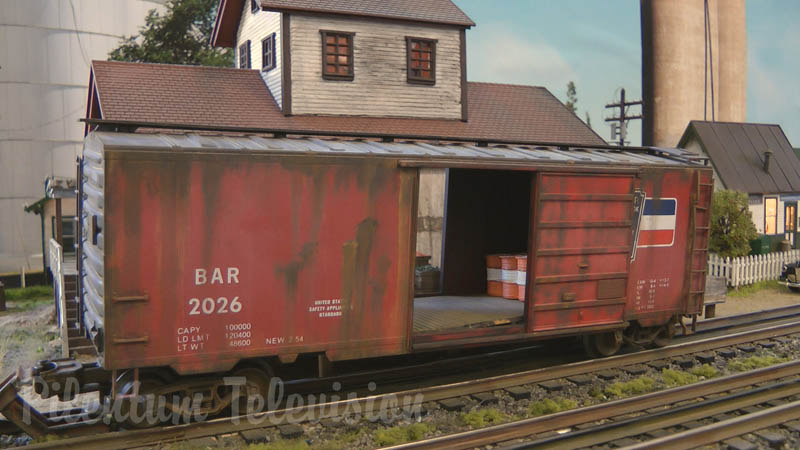 Weathering model trains on a three rail model railroad layout in O scale